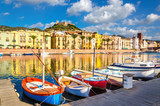 Fototapeta Morze - Colorful houses and boats in Bosa, Sardinia, Italy, Europe