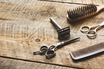 Wall Mural - Tools for cutting beard barbershop on wooden background