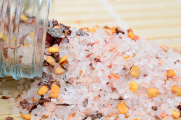 Canvas Print - pink salt with chili seed on table