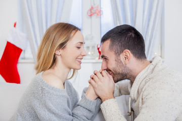 Wall Mural - Young couple in love on Christmas night