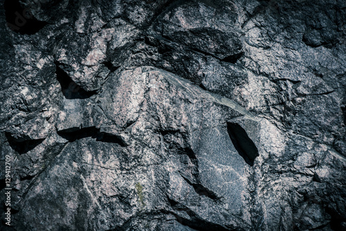 Stone background, rock wall backdrop with rough texture Canvas Print