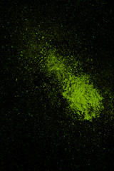 Green colorful powder splash isolated on black background.jpg