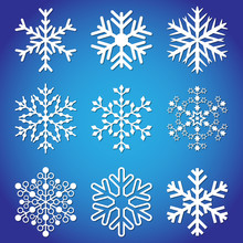 Set Of Snowflakes. Nine Different White Snowflakes On A Blue Background.