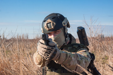 Wall Mural - airsoft soldier portrait with pistol