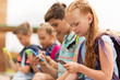 © Syda Productions - elementary school students with smartphones