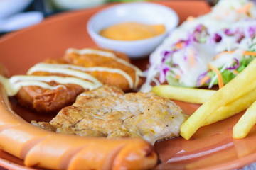 Wall Mural - pork steak with vegetable small salad