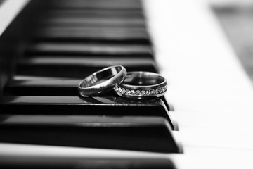 Wedding rings and piano
