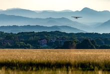 Small Airplane Lifting Off A Grass Airfield Near Zagreb, Croatia.