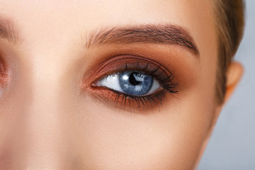 Close-up shot of female eye make-up in smoky eyes style