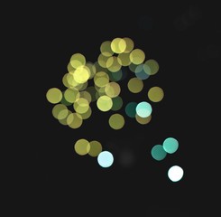 light blur and defocus bokeh circles on black sky background