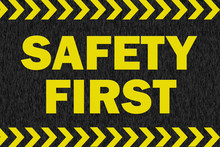 SAFETY FIRST Sign On Black Background