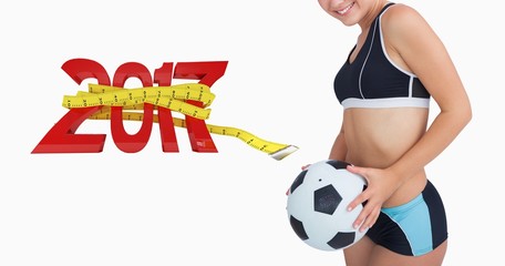 Poster - Composite image of portrait of happy woman in sportswear with fo