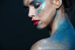 © Drobot Dean - Beauty portrait of pretty woman with blue sparkling fashion makeup