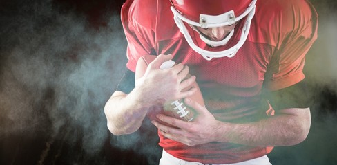 Poster - Composite image of american football player protecting football