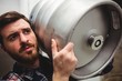 © WavebreakMediaMicro - Brewery manufacturer carrying keg