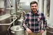 © WavebreakMediaMicro - Brewery manufacturer standing by storage tank