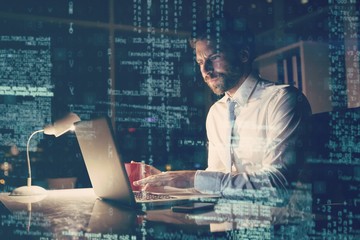 Poster - Businessman using laptop at night