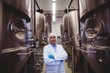 © WavebreakMediaMicro - Manufacturer standing at brewery