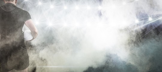 Poster - Composite image of rugby player holding the ball