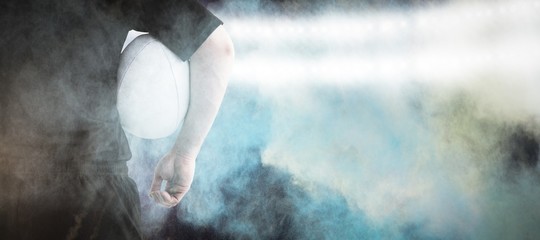 Poster - Composite image of rugby player holding a rugby ball