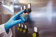 © WavebreakMediaMicro - Manufacturer hand on control panel in brewery