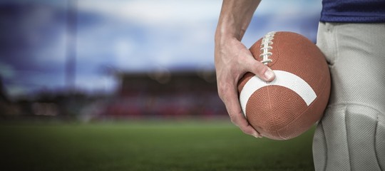 Poster - Composite image of close-up of sports player holding ball