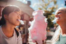 Two Young Women Sharing Cotton Candyfloss