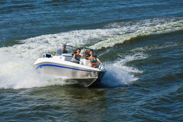 Wall Mural -  Girls ride on the boat to drift