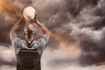 Wall Mural - Composite image of athlete throwing rugby ball 3D