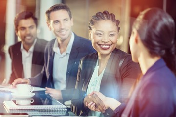 Poster - Businesswoman shaking hands with colleague