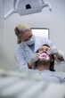 © WavebreakMediaMicro - Dentist examining a patient with tools
