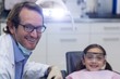 © WavebreakMediaMicro - Portrait of smiling dentist and young patient