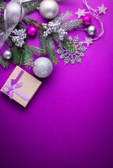 Wall Mural - Purple Christmas background with a present