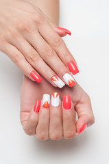 Festive manicure orange white with elements of broken glass