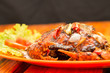 © Haryanto - Crab cooked with black pepper sauce on plate with chili and onion