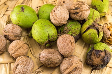 Wall Mural - Bunch of walnuts on a wicker basket