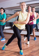 © JackF - Happy people learning zumba steps