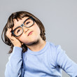 © STUDIO GRAND WEB - serious preschooler with eyeglasses for thought, imagination, confusion or headache