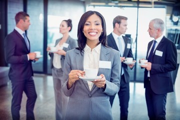 Poster - Portrait of businesswoman having tea during break time