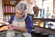 © WavebreakMediaMicro - Female potter making pot
