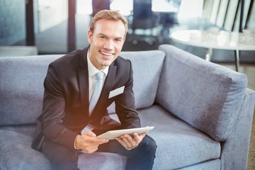 Poster - Happy businessman using digital tablet