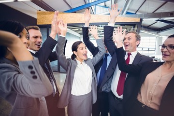 Poster - Cheerful businesspeople raising hands