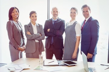 Poster - Portrait of business people standing together in conference room