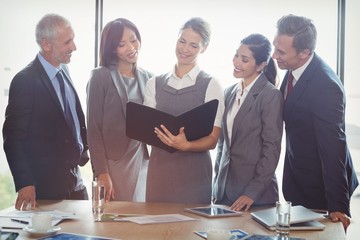 Poster - Businesswoman looking at organizer