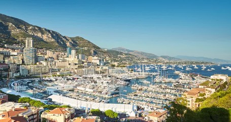 Wall Mural - Monaco, Monte-Carlo, 27.09.2016: Timelapse of first day MYS Monaco Yacht Show, Port Hercules, luxury megayachts, big boat, view from Princes Palace of Monaco, sunset, aerial view, 4k video