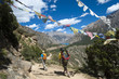 © robertharding - Prayer flags mark a high point in the trail where trekkers are rewarded with their first glimpse of Phoksundo Lake, Dolpa Region, Himalayas, Nepal