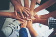 © Johnstocker - Teamwork togetherness collaboration, business teamwork concept.