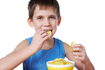 Wall Mural - Little boy eating potato chips isolated