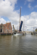Noorderhaven Canal With Boats, Open Bridge And Houses In Historic Old Town Of Harlingen, Friesland, Netherlands