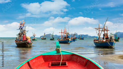 Fishing boat at clean beach Poster Mural XXL